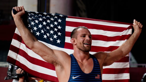 Former Penn State wrestler David Taylor celebrates winning a gold medal at the 2020 Summer Olympics in Tokyo.